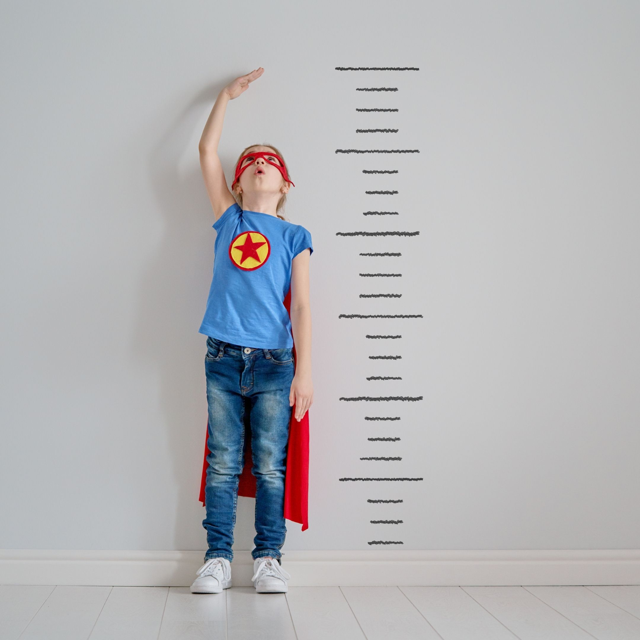 Boy measuring his height. Hire a child support lawyer in medina for child support that is appropriate as your child grows.